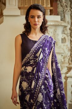 Purple saree with floral pattern and floral beads embroidery on border.
Components: 1
Pattern: Embroidered
Type Of Work: Floral
Fabric: Chinon
Color: Purple
Other Details: 
Beads detailing
Attached lining
Note: The blouse worn by the model is not for sale
Occasion: Puja - Aza Fashions Saree Women, Purple Saree, Beads Embroidery, Fashion App, Not For Sale, Sarees Online, Floral Fabric, Purple Floral, Aza Fashion