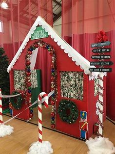 a christmas themed house with candy canes on the floor