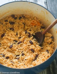 a blue pot filled with rice and beans