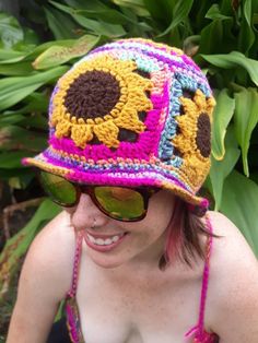 Meet one of the pieces that truly inspired my Sunflower Collection. These hats are made to order and made for average adult sized heads. Available in 4 acrylic color options. Each color is variegated, meaning that I have little control over the color changes. This makes each hat truly unique. Perfect for spring and summer as a colorful, casual look.  MEASUREMENTS  Youth/XS 9.25 inches from top of crown to brim 20 inches around 4 inch wide flower band 1.5 inch wide brim 6.5 inch across top of hat Y2k Bucket Hat, Sunflower Bucket Hat, Sunflower Bucket, My Sunflower, Sunflower Hat, Cool Beanies, Edm Rave, Rave Bra, Flower Band