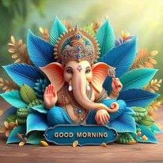 an elephant statue sitting on top of a wooden table next to a sign that says good morning