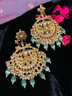 These gorgeous wedding Kundan earrings will add a perfect charm to your occasion wear. You will definitely fall in love with this mint green beauty and it will make you stand out among the crowd. Pachi Kundan Fusion Style Kundan Bridal Earrings For Wedding, Fusion Kundan Bridal Earrings For Weddings, Traditional Bridal Earrings For Reception, Traditional Elegant Bridal Earrings For Reception, Fusion Style Kundan Bridal Earrings For Reception, Festive Bridal Chandbali Earrings With Elegant Design, Green Meenakari Bridal Earrings For Reception, Bollywood Green Bridal Earrings For Reception, Green Bridal Earrings For Reception On Diwali