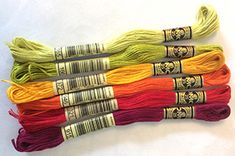 six skeins of different colors of yarn