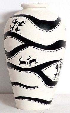 a black and white vase with animals painted on it