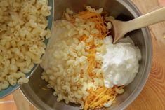 macaroni and cheese being mixed together in a bowl