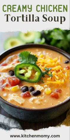 creamy chicken tortilla soup in a black bowl