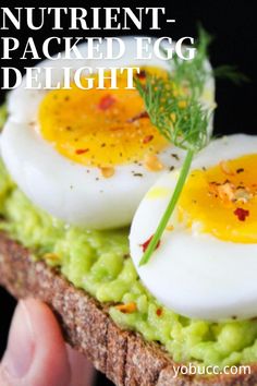 an egg is sitting on top of some bread with green vegetables and herbs in it