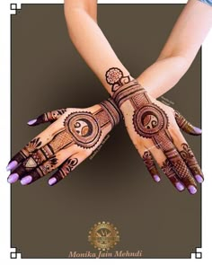 two hands with henna designs on them