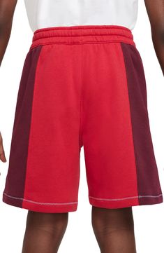 Comfort and style balance out in these kid-approved cotton-blend shorts fashioned with a drawstring waist and stand-out logo stitching. 80% cotton, 20% polyester Machine wash, tumble dry Imported Casual Gym Shorts With Color Block, Casual Color Block Gym Shorts, Red Cotton Athletic Shorts For Sports, Sporty Red Cotton Athletic Shorts, Sporty Red Cotton Activewear, Red Cotton Sporty Athletic Shorts, Red Cotton Athleisure Activewear, Nike Red Sporty Shorts, Nike Relaxed Fit Cotton Shorts