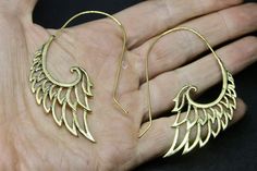 -- Feather earrings -- 5.5cm by 4.6   -- brass -- I offer deals on my earrings if you buy more than one pair -- Comes with silk gift bag -- Thanks for looking :) Handmade Gold Wing-shaped Earrings, Feather Angel Wings, Silk Gifts, Angel Wing Earrings, Wing Earrings, Feather Earrings, Jewelry Earrings Hoops, Angel Wings, Gift Bag