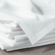 white sheets folded on top of each other