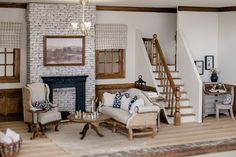 the living room is decorated in white and wood