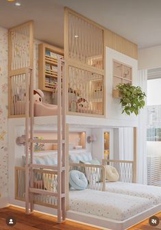 a room with bunk beds in it and a plant next to the bed on the wall