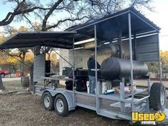 a trailer with an open roof and some equipment on it