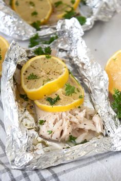 lemons, parsley and chicken in foil packets