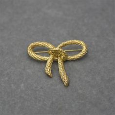 This gold vintage brooch is the perfect way to show your appreciation and love for your mother, wife, or daughter. It also makes a fantastic gift for Mother's Day or a birthday present for that someone special.👌 M A T E R I A L• Gold-plated Brass• This product is hypoallergenic (nickel free) and tarnish resistant📏 S I Z E• Length: 5 cm (2.2 inch)• Weight: 4.5 cm (1.8 inch)• Weight: 15 g Vintage Yellow Gold Pins For Gifts, Vintage Yellow Gold Pins For Gift, Yellow Gold Brooches For Anniversary, Gold Brooch Pin As Gift, Gold Brooch Pins As Gift, Yellow Gold Brooch Pin For Gift, Yellow Gold Brooch Pins As Gift, Vintage Gold Pins For Anniversary, A Birthday Present