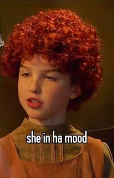 a young boy with red hair has the words she in a mood