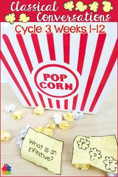 a popcorn bag with the words pop corn on it and two pieces of paper next to it