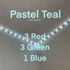 three red green blue and white lights in a room with the words pastel teal