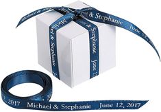 a white box with a blue ribbon around it