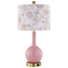 a pink table lamp with a gold base and floral fabric shade on the top, sitting on a white background