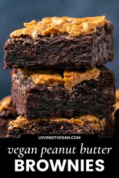 chocolate brownies with peanut butter frosting stacked on top of each other in a plate