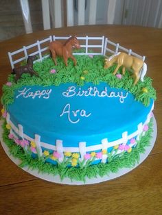 a birthday cake with horses on top of it