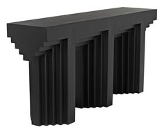 an art deco console table in black lacquer, with three columns on each side