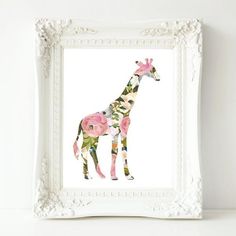 a giraffe with pink flowers on it's body in a white frame