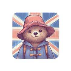 a teddy bear wearing a hat and coat with the british flag in the back ground