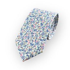 This Ditsy Floral Tie Features A Refreshing Coastal Color Palette Making It A Perfect Choice For A Wide Range Of Outdoor Wedding Styles Including Garden, Beach And Destination Weddings. The Light And Airy Floral Design Reflects The Laid-Back And Relaxed Atmosphere Of These Types Of Weddings And Would Complement The Surroundings - A Great Choice For A Groom Or Groomsman Who Wants To Add A Touch Of Personality And Style To His Outfit While Still Looking Polished And Put-Together. This Versatile Ti White Summer Tie, Classic White Ties For Spring, Classic White Spring Ties, White Floral Print Ties For Summer, Summer Floral Print White Ties, Summer White Floral Print Ties, White Cotton Summer Ties, White Cotton Ties For Summer, Classic Floral Print Ties For Summer