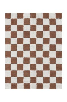 a brown and white checkered rug on a white floor with an area rug in the middle