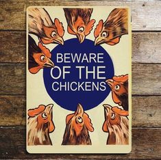 a sign that says beware of the chickens on it's front and back