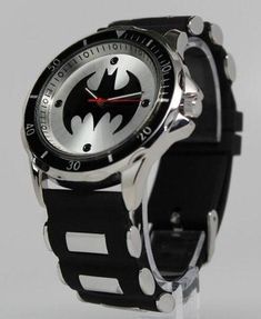 Batman watch that is a young adult / adult sized watch that features the Batman logo. Uses Japan movement. Stainless steel caseback. The bracelet is silicon / rubber in black with metallic accents. Perfect for the Batman in your life. Watch case measures about 1.7 inches in diameter. Bracelet is 1 inches wide. Watch is shipped with a crown stopper, protective film of the glass/crystal, and a protective film/sticker on the caseback. The crown stopper prolongs the battery. Watch is about 10.5 inch Casual Silver Watch With Stopwatch, Batman Furniture, Batman Gadgets, Batman Jewelry, Batman Signal, Iron Batman, Batman Wedding Rings, Batman Watch, The Batman Logo