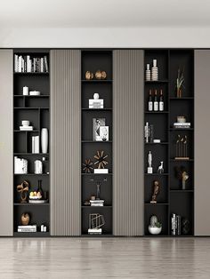 an empty room with black bookshelves and white walls