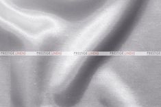 a white satin fabric with the word prestige on it