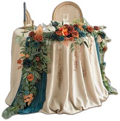 the table cloth is covered with flowers and leaves