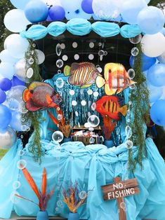 an ocean themed birthday party with balloons and decorations