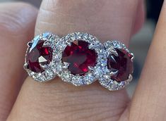 Stunning Ruby Ring White Gold.  GIA certified natural rubies, full certificates included.  3.62 Carats total weight of Rubies. Gorgeous deep velvet red color, clear and very vibrant; even outside in the sunlight.  No pink tone, deep rich red color, full of life. Excellent craftsmanship, the diamonds are very brilliant.  Smooth setting, very comfortable ring to wear everyday.  This 3 stone ring symbolizes for your past present future together.  Heirloom quality ring.  One Only! Genuine earth mined rubies GIA Certified  Total weight: 3.62 Carats  Dark Red Colors  Amazing shine and luster Heated Genuine earth mined round brilliant cut diamonds total weight: 0.98 Carats F Color  Solid 18K white gold  Stock ring size 7 Comes with gift box If for one reason or another your order did not meet you Luxury Radiant Cut Ruby Ring As A Gift, Luxury Multi-stone Ruby Ring In Sterling Silver, 3 Stone Ruby And Diamond Ring, Luxury Oval Ruby Cluster Ring, Past Present Future Ring, Ring Bands, 3 Stone Ring, Natural Ruby Ring, Ruby And Diamond Ring