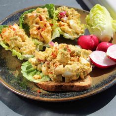 an egg salad on toast with radishes and lettuce