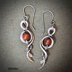 "The jewelry is delivered by Fedex, the delivery time is 3-4 working days! Romantic shape earrings with red carnelian natural gemstone beads. The earrings are antiqued and polished. Earrings length appr. 5.5 cm (2.1\"). I will send the jewel in bubble wrap and a small box. You can find more earrings by me here: https://www.etsy.com/shop/EWirehu?ref=seller-platform-mcnav&section_id=24484424 Thank you for your visit! :)" Wire Jewelry Earrings, Twist Jewelry, Fantasy Earrings, Wire Wrap Jewelry Designs, Wire Wrapped Jewelry Diy, Aluminum Jewelry, Red Carnelian, Wrap Earrings, Wire Jewelry Designs