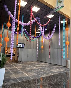 an airport lobby decorated with balloons and streamers