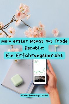 a person holding a smart phone in their hand with the text mein erster monot mit trade republic