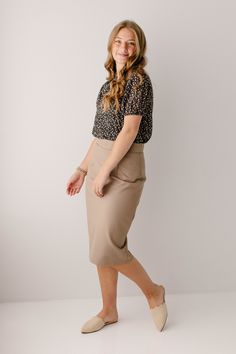 With clean, simple lines and sophisticated style, the 'Anna' is the perfect pencil skirt your closet has been waiting for. Quality fabric, full lining and structured style ensure a modest and flattering fit while an elastic waistband keeps you comfortable. Exclusively designed with you in mind! 68% Rayon 27% Nylon 5% Spandex Hand Wash Cold Separately or With Like Colors Do Not Bleach Hang to Dry Low Iron if Needed 1.75" Waistband Fully Lined ﻿Color may be slightly darker than shown Model Height Beige Fitted Midi Length Pencil Skirt, Fitted Beige Midi Length Pencil Skirt, Relaxed Knee-length Pencil Skirt For Office, Workwear Midi Pencil Skirt, Flattering Relaxed Skirt For Work, Flattering Lined Skirt For Workwear, Office Pencil Skirt With Lining, Chic Stretch Skirt For Office Wear, Office Lined Pencil Skirt