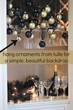 a shelf with wine glasses and ornaments hanging from it