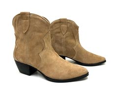 A modern cowgirl boot made to stay in style all year long. Match with jeans, skirts, dresses and shorts while experiencing lasting comfort with its padded insoles, spacious shaft openings and smooth suede uppers that form this vibrant olive bootie. Slip-on Block heel Pointed-toe Soft interior lining Cushioned leather footbed Composition: Upper: 100% Suede Outsole: 100% Rubber Footbed: 100% Leather Lining: 100% Leather Measurements: Heel Height: 2.5" Other colors: Olive New Collection Chili Beige Suede Moto Ankle Boots For Rodeo, Western Style Suede Boots For Spring, Western Suede Mid-calf Boots For Spring, Western Suede Moto Boots For Fall, Casual Suede Boots For Ranch, Casual Ranch Boots For Fall, Country Style Suede Boots With Round Toe, Casual Moto Boots For Ranch In Winter, Casual Suede Heeled Boots With Snip Toe