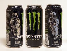 three cans of monster energy drink on a white background