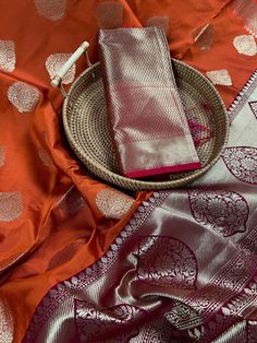 Light Weight and Amazingly Beautiful Handloom Banarasi Katan Silk Saree with Meenakari Work on the borders. Very Unique Burnt Orange Color with Gold Zari Weave and Wine Color Pallu. Tassels add to the beauty of the Saree. Item : SareeColor : Burnt Orange Base Fabric : Banarasi Katan Semi SilkBlouse piece : Comes with Blouse piece Disclaimer -:- Color variation is possible due to various reasons like phone or desktop setting, resolution etc. Please don't hold us responsible. Our aim is to put the Orange Tissue Silk Traditional Wear With Self Design, Traditional Tissue Silk Sets For Ceremonies, Katan Silk Sets With Zari Weaving For Puja, Orange Banarasi Silk Set With Pallu, Tissue Silk Traditional Wear With Meenakari For Puja, Orange Anarkali Sets With Zari Weaving, Traditional Banarasi Silk Sets With Self Design, Orange Wedding Blouse Piece With Traditional Patterns, Wedding Orange Blouse Piece With Traditional Patterns