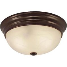 a ceiling light with a white glass shade