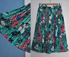 Vintage floral pleated skirt, from the 1990s era Below the knee, pleated skirt with an elastic waist, black lining and no pockets. The skirt has a rich floral print in mostly turquoise green with pink, blue, gray and white. Material - 100% polyester Brand - C&A Size - 20 (vintage), fits like contemporary M or a small L because of its stretchy waist. Please look at measurements below: Measurements ( taken when skirt lying flat, double waist) Waist (double that) - comfortably stretches from 13 Vintage Flowy Pleated Skirt For Spring, Green Pleated Skirt With Accordion Pleats For Summer, Retro Accordion Pleats Skirt For Spring, Green Accordion Pleats Skirt For Summer, Green Pleated Full Skirt For Spring, Spring Retro Skirt With Accordion Pleats, Green Accordion Pleats Skirt For Spring, Retro Spring Skirt With Accordion Pleats, Multicolor Floral Print Flared Skirt